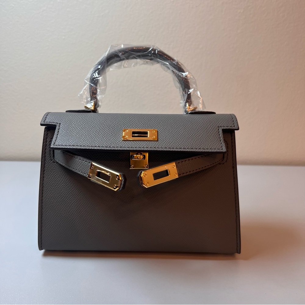 Genuine Epsom Leather mini handbag with shoulder strap featuring Gold hardware